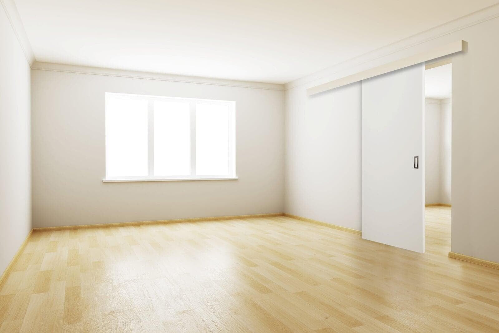 Witte houten schuifdeur van Thys voor de muur, met opbouwrail